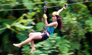 Woman rides a zipline at the Sleeping Giant Zipline in Fiji
