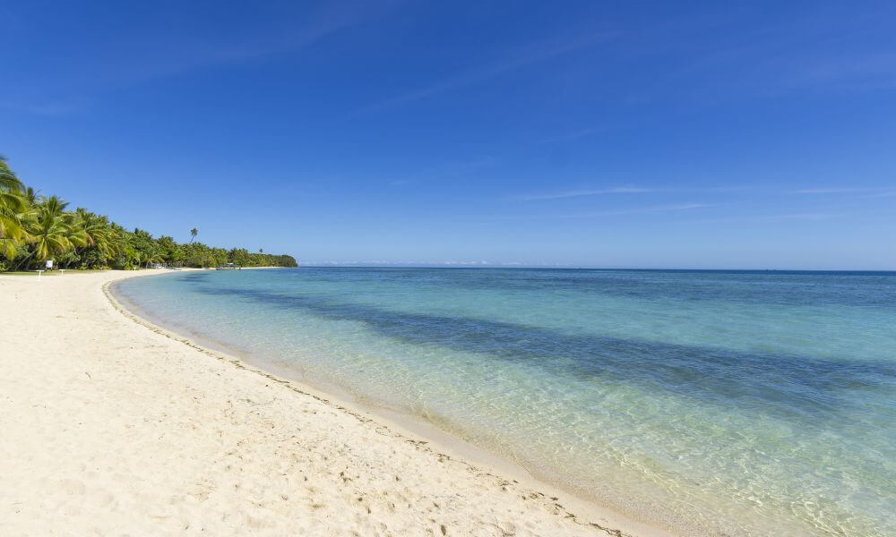 Long white sandy beach on a Fiji island